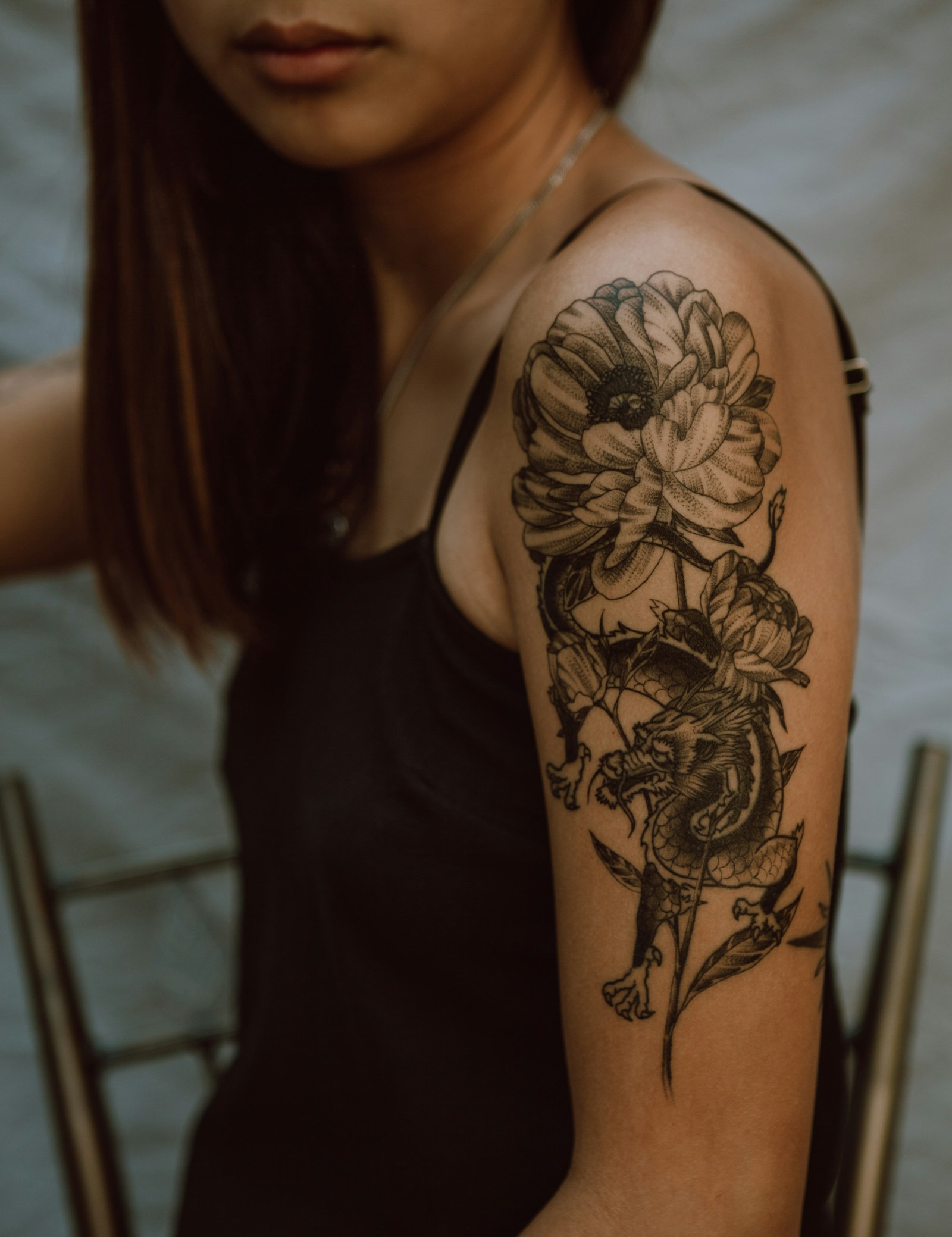 Editorial atmosphere image of botanical tattoo art; not Inky Apricot portfolio work